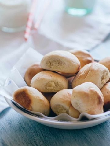 a bowl filled with pan de leche - a sweet bread made with milk