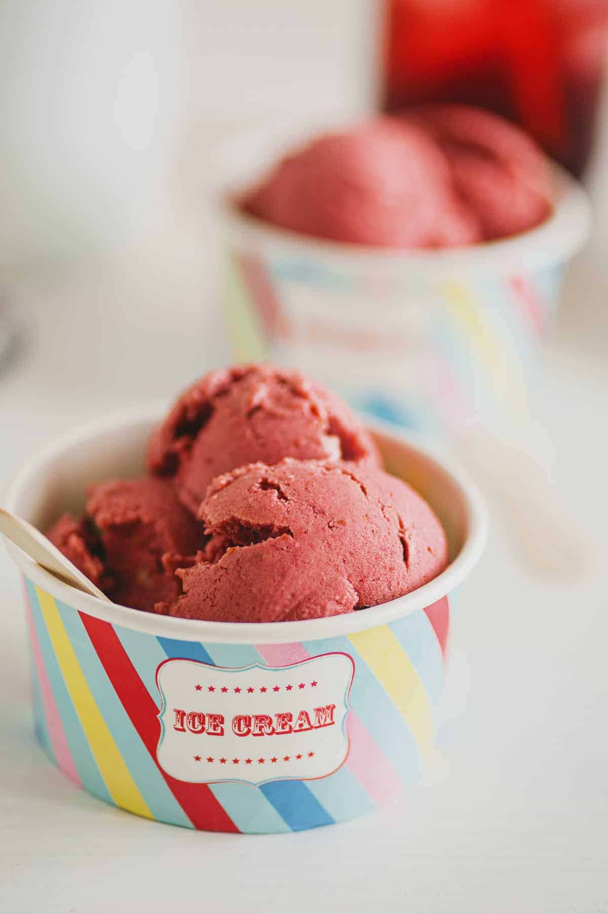 a small tub of vegan raspberry ice cream