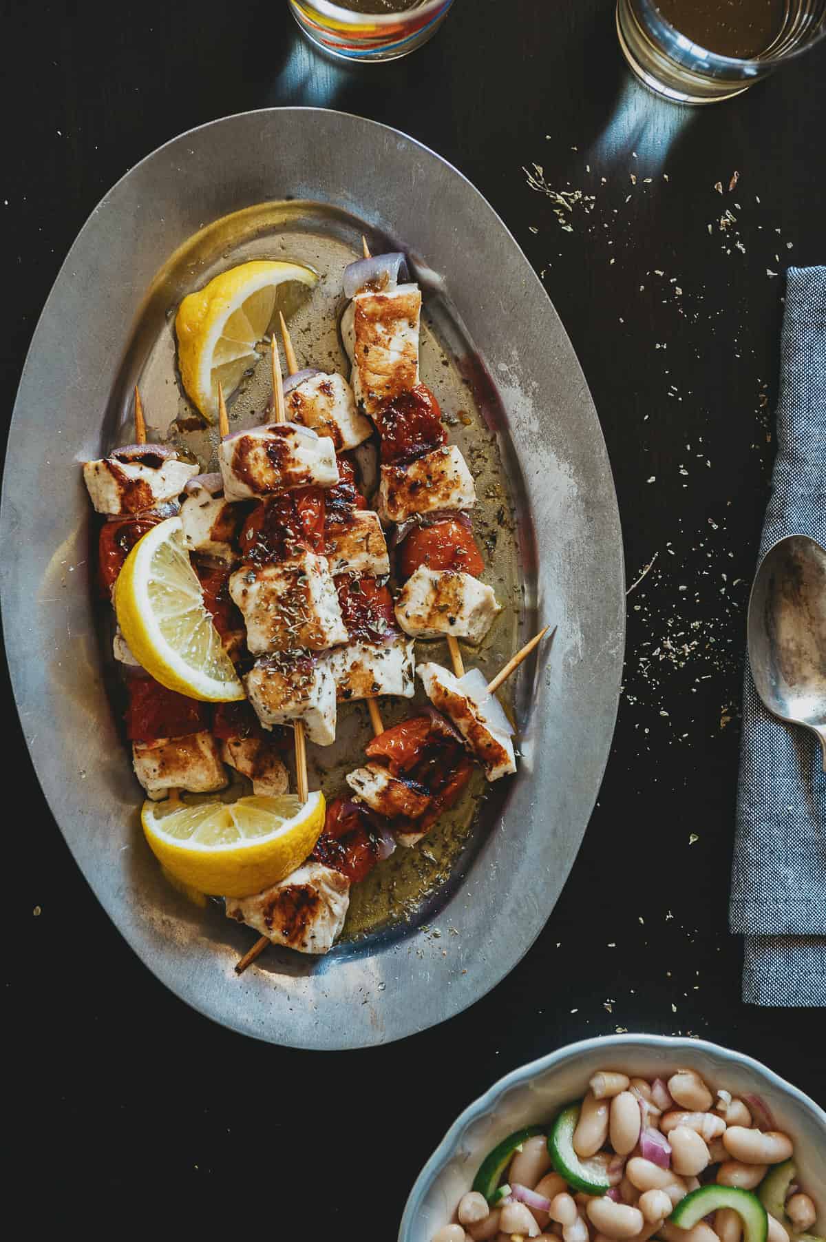 a silver platter with 6 serves of freshly grilled swordfish souvlaki