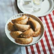mini cheese pies served on a pie stand