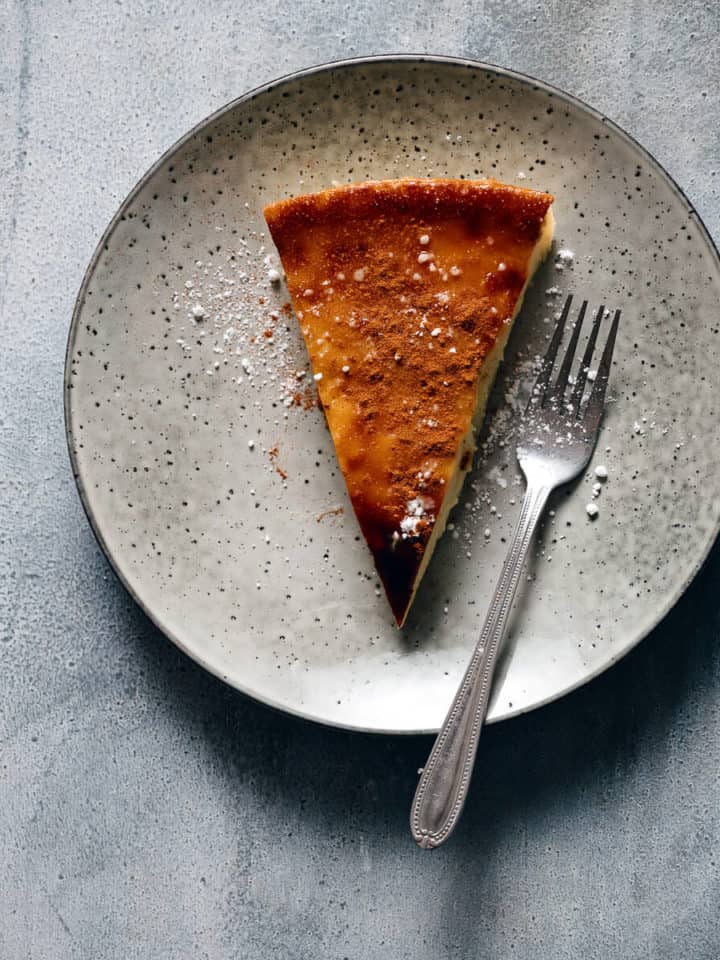 a slice of pie served on a grey plate