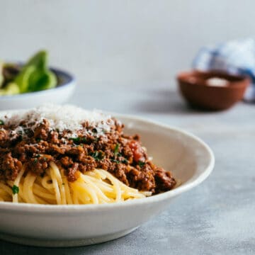 a bowl of makaronia me kima - greek spaghetti with a meat sauce.