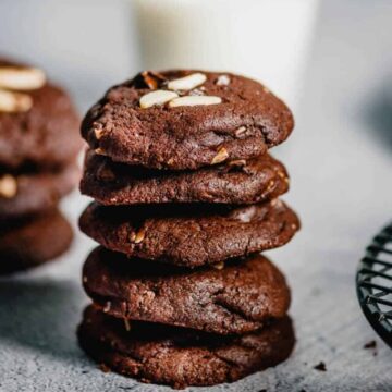 5 chocolate almond cookies stacked up.