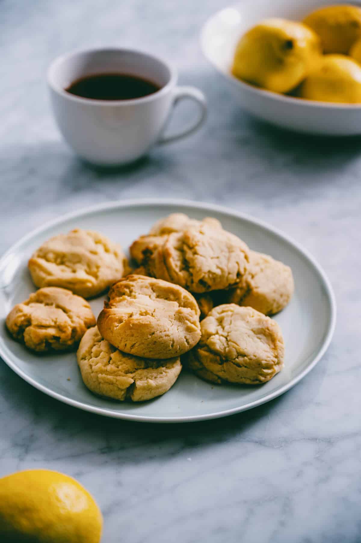 close up view of lemon cookies on a plate.