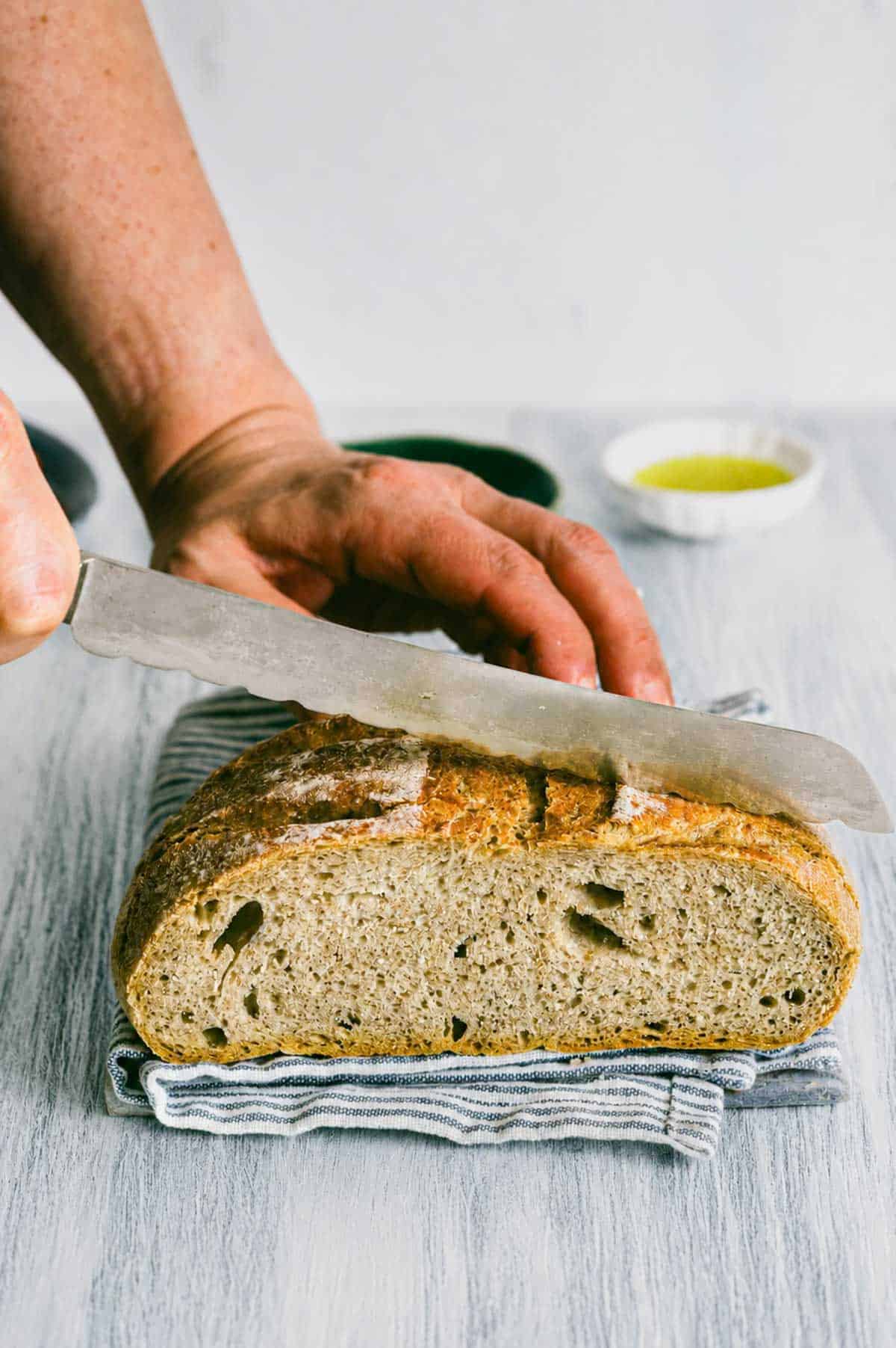 sourdough bread being sliced.