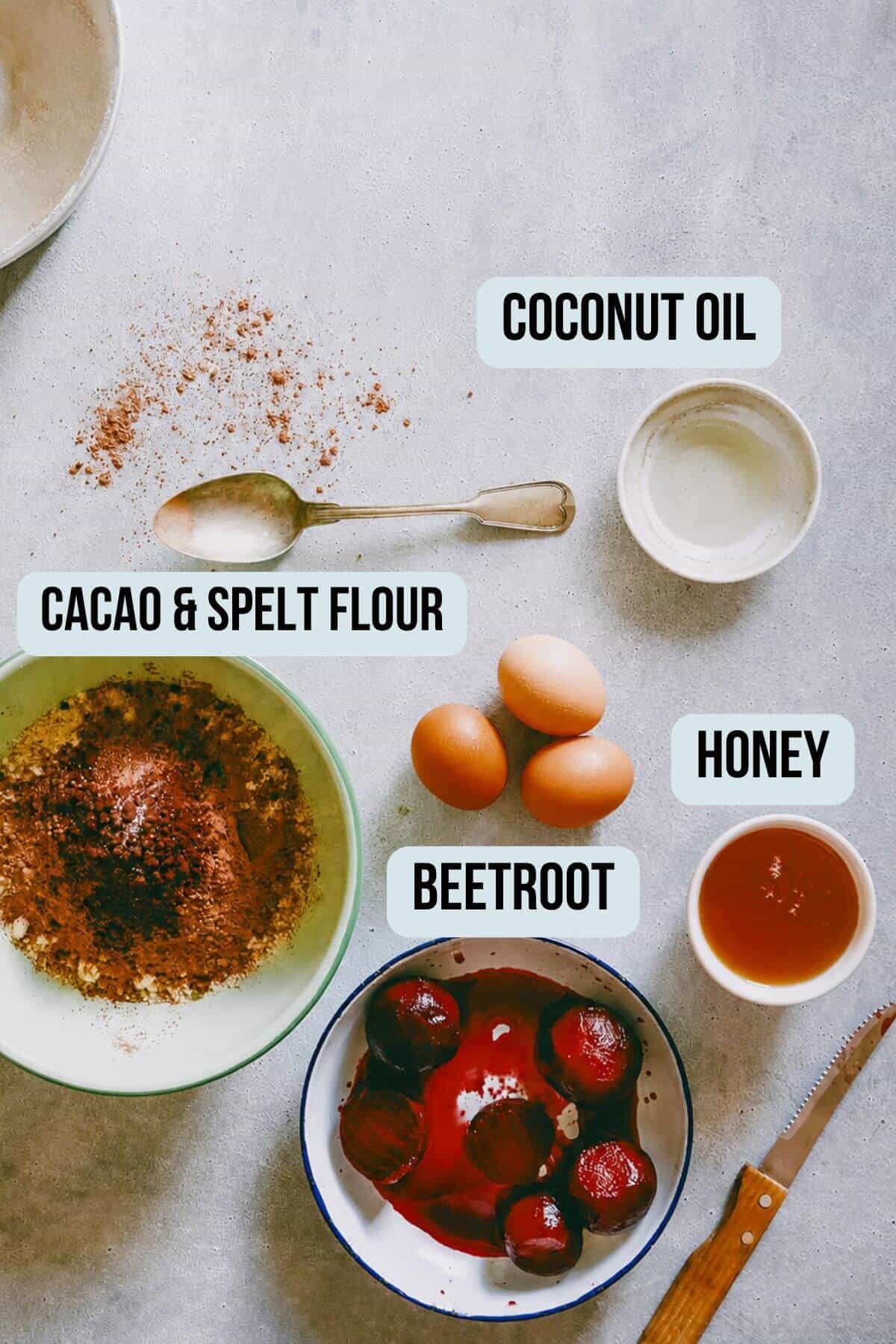 Ingredients for chocolate beetroot cake including beetroot cacao eggs honey and coconut oil.