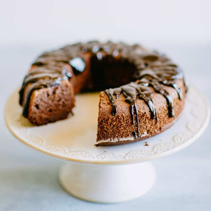 Slice cut from chocolate beetroot cake showing soft and moist crumb.